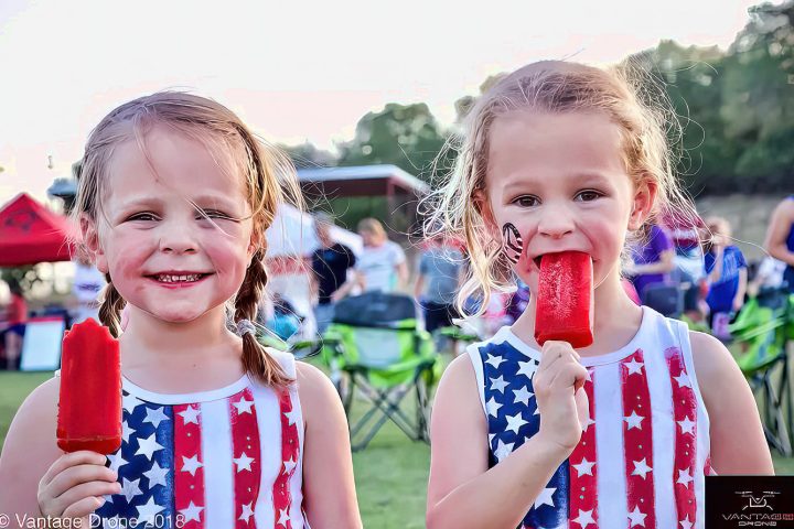 Girls eating popsicles